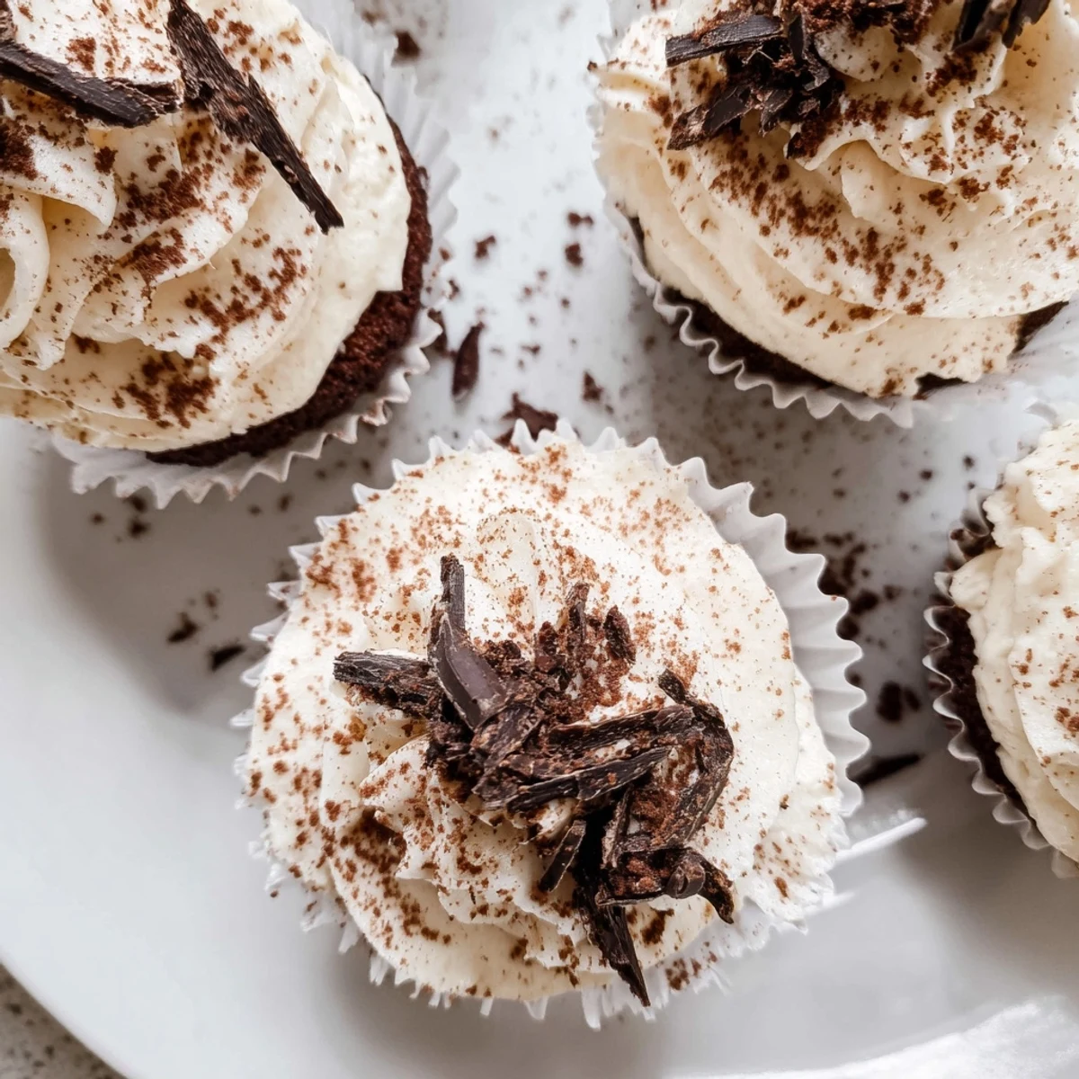 Italian-inspired chocolate tiramisu cupcakes with espresso-soaked layers and smooth mascarpone cream topping