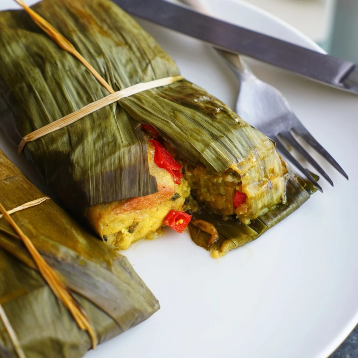 Creamy spiced Malaysian Otak Otak steamed in aromatic banana leaves with coconut milk