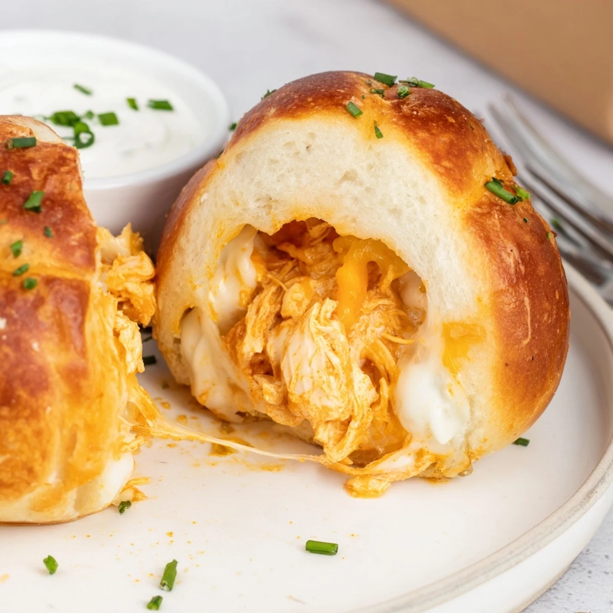 Game day Buffalo Chicken Mozzarella Bombs filled with spicy chicken, cooled with blue cheese.
