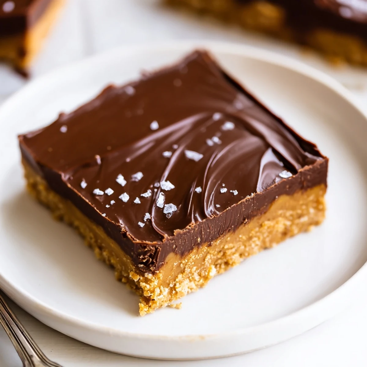 A tray of No Bake Peanut Butter Bars topped with flaky sea salt