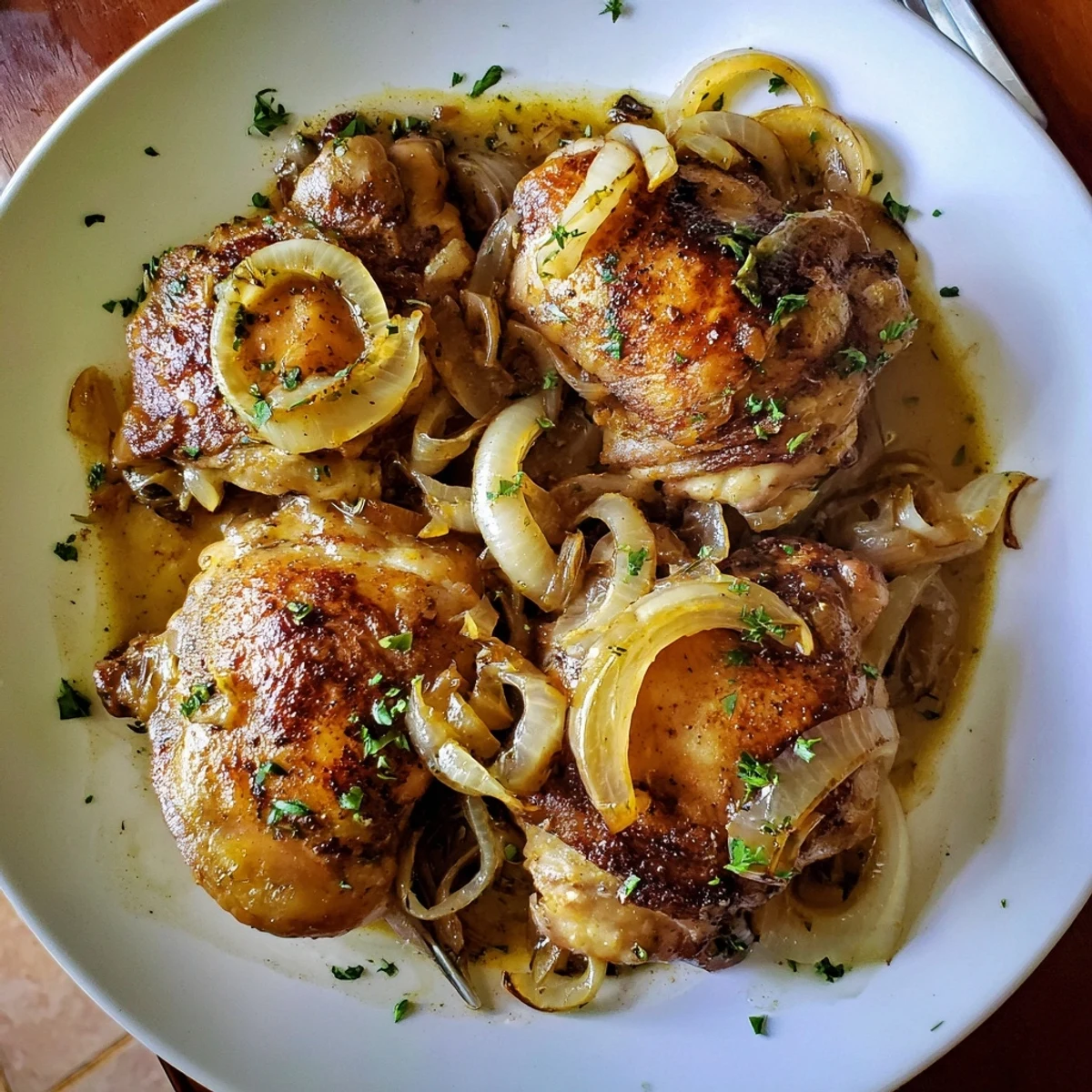 Savory Smothered Chicken Thighs In Rich Gravy Recipe, golden seared skin, onion aroma