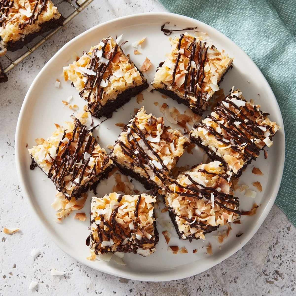 No bake Samoa bites topped with caramel coconut and drizzled melted dark chocolate