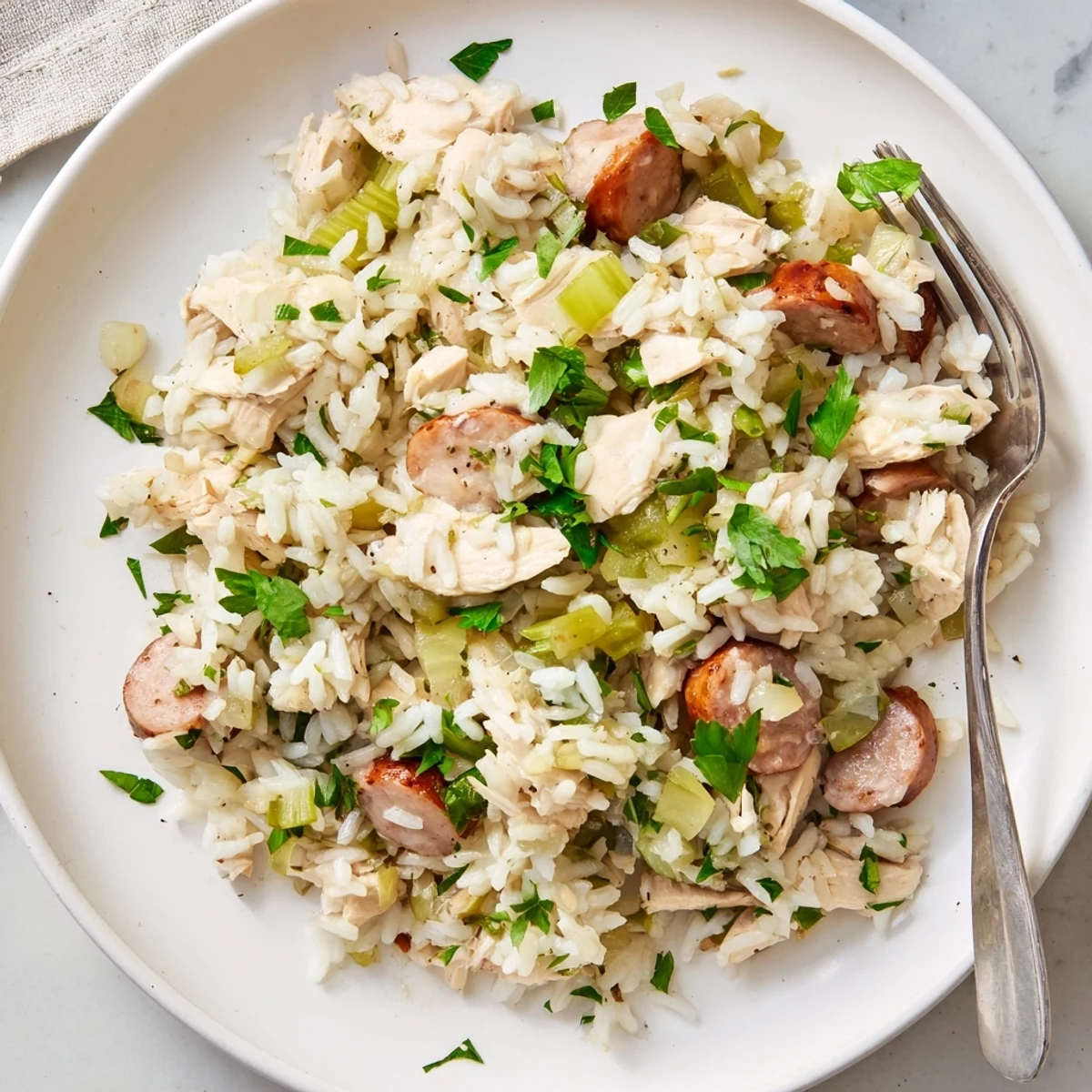 One-pot Southern Chicken Bog featuring rice, chicken pieces, and smoked sausage in a rich broth