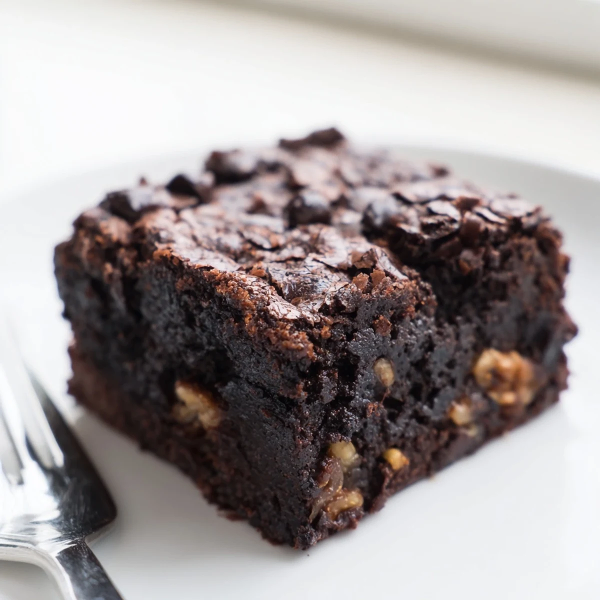 Warm homemade brownies topped with vanilla ice cream and drizzled chocolate sauce